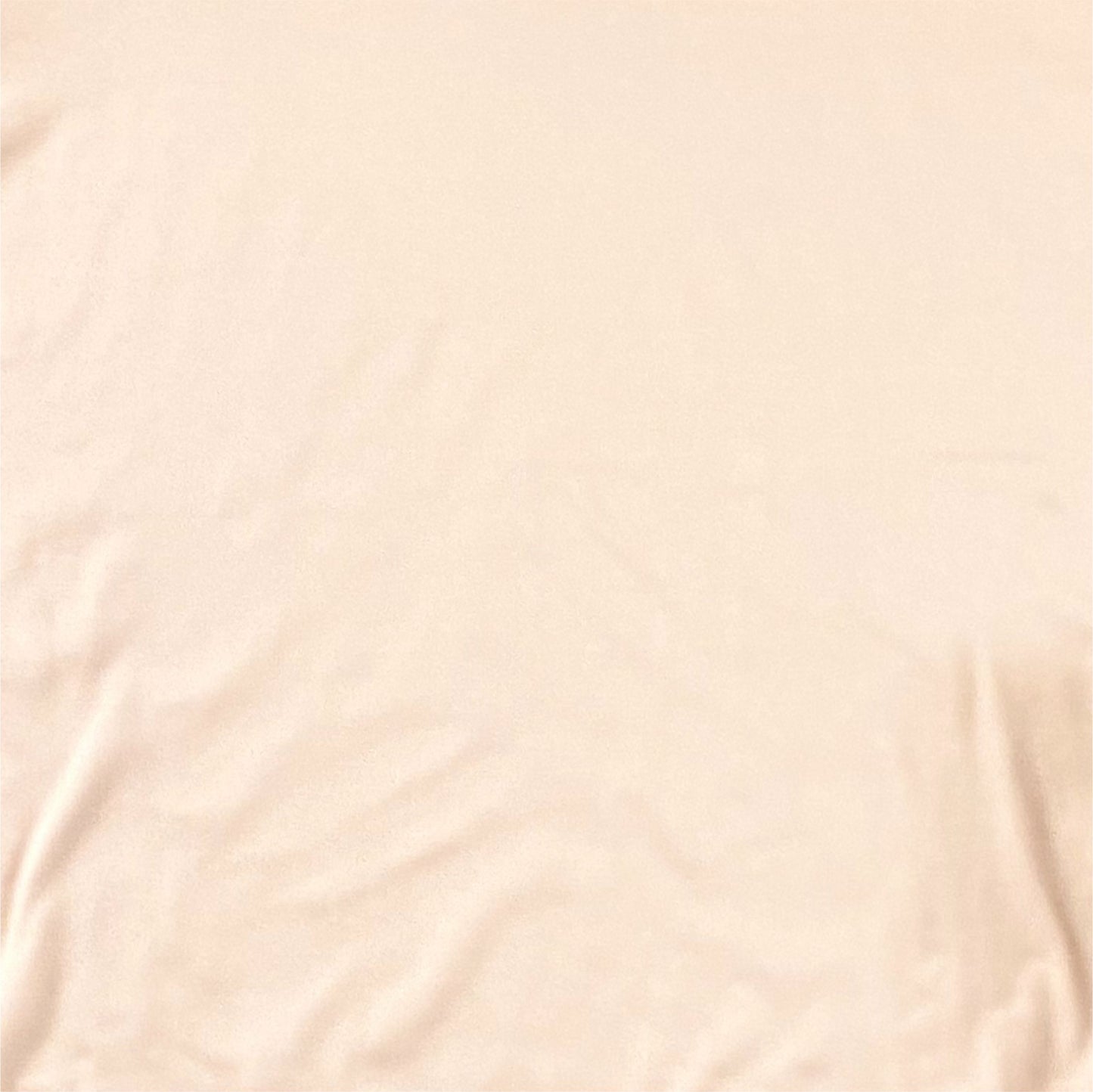 close up of peach fabric showing soft texture