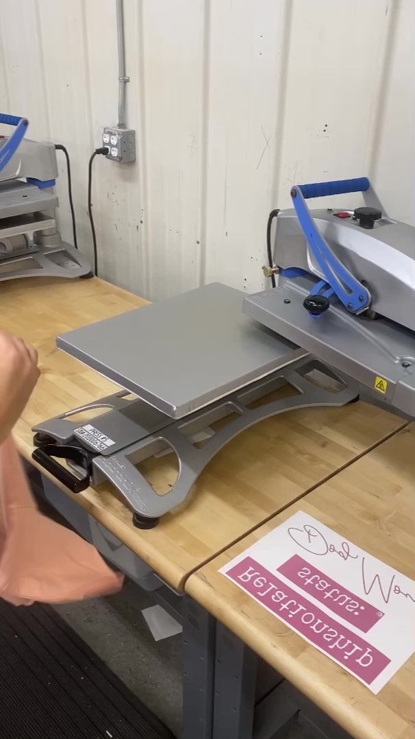 Instructional video for pressing a design onto a peach tee using sublimation press