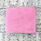 Plush pink blanket, folded.
