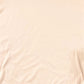 close up of peach fabric showing soft texture